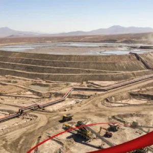 Aerial view of a modern mine tailings storage facility with ponds and containment structures